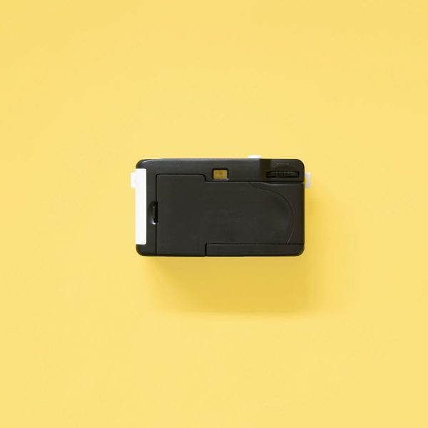 Kodak i60 35mm Film Camera Blue back on yellow background