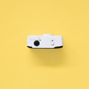 Kodak i60 35mm Film Camera Blue top on yellow background