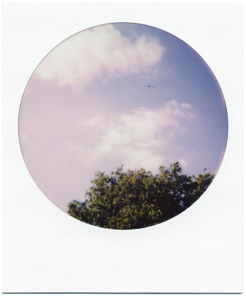 Polaroid 600 Color Round Frames Instant Film Review. Airplane above Ruskin Park