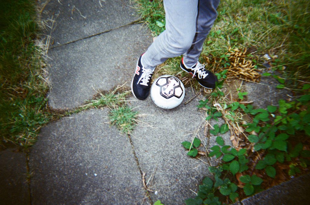 Football feet in garden Dubblefilm Daily Color 35mm