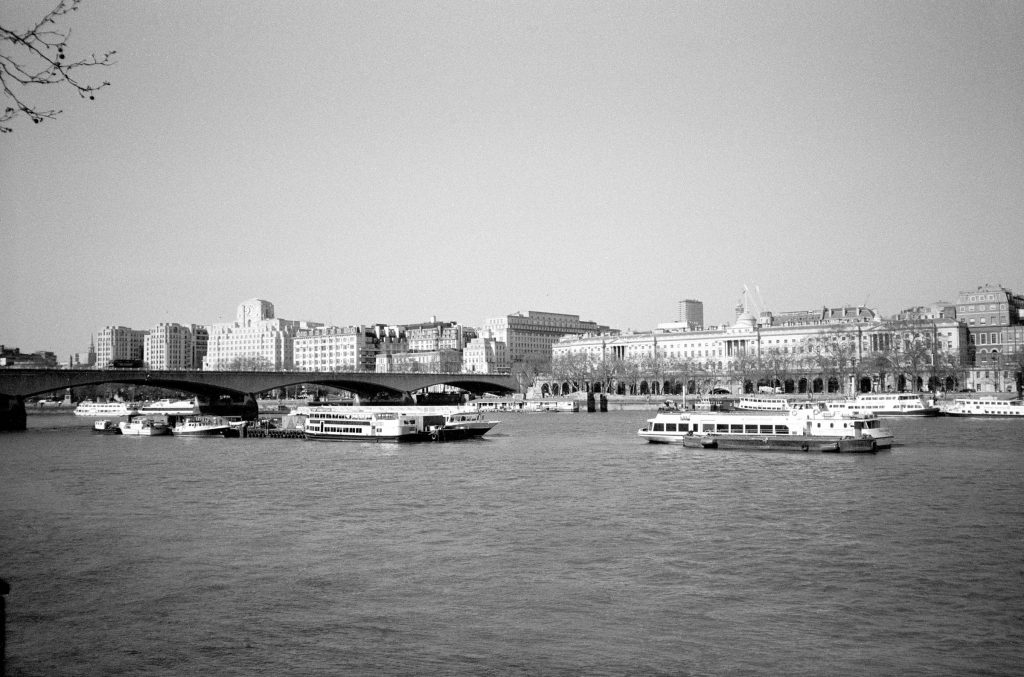 Boats on the Thames by Waterloo Bridge. Shot on B&W Lomography 35m Film