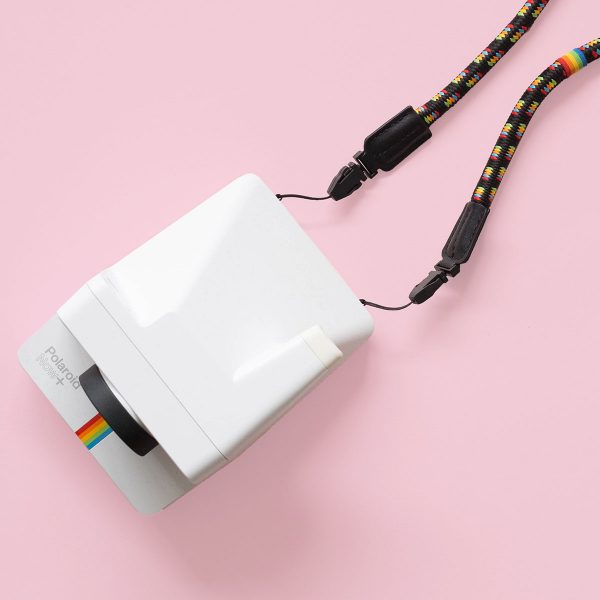 Polaroid Camera Strap Round Rainbow on pink background