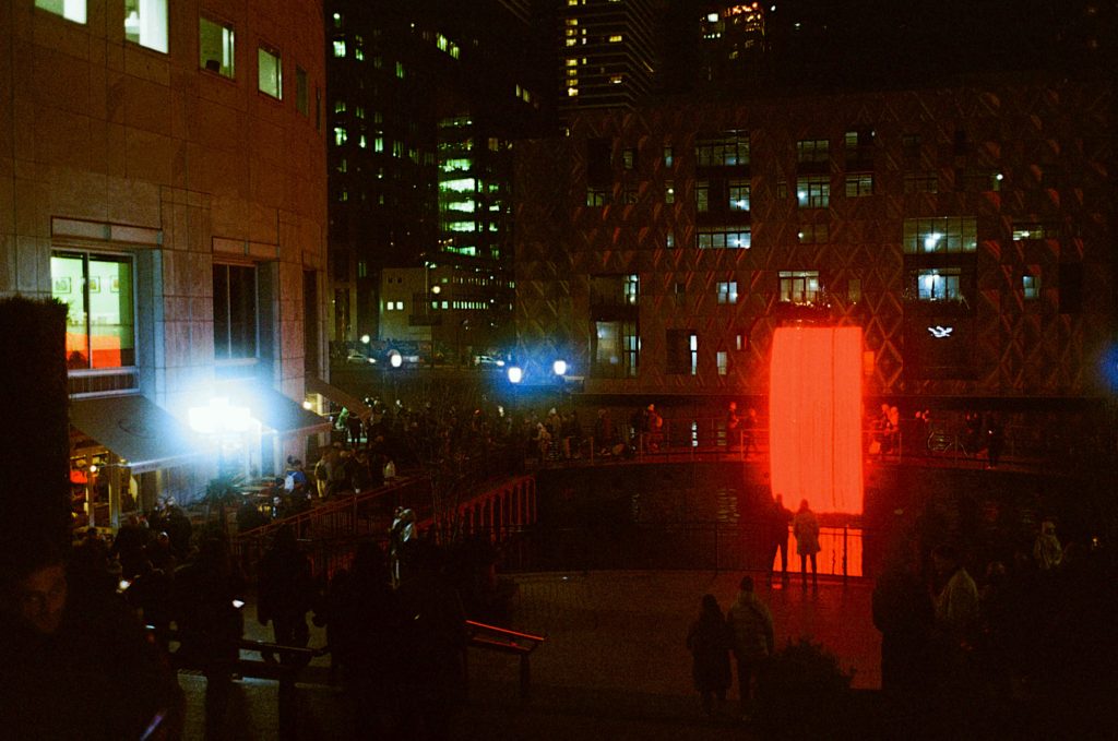 Red light and buildings at night on Kodak Ultramax pushed to 1600