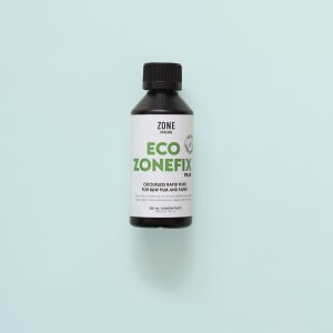 Bottle of Eco Zonefix 250mll on a teal background
