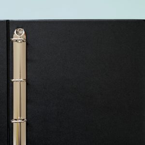 Kenro Negative Ringbinder open on a pink background