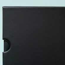 Kenro Negative Ringbinder and slipcase closed on a green background