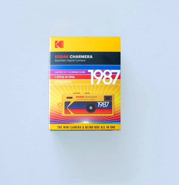Kodak Charmera Digital Camera Keychain Box on a blue background