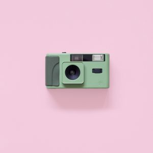 Long Weekend 35mm Film Camera Moss on a pink background