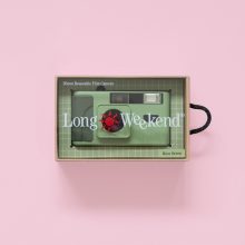 Long Weekend 35mm Film Camera Moss in a clear box on a pink background