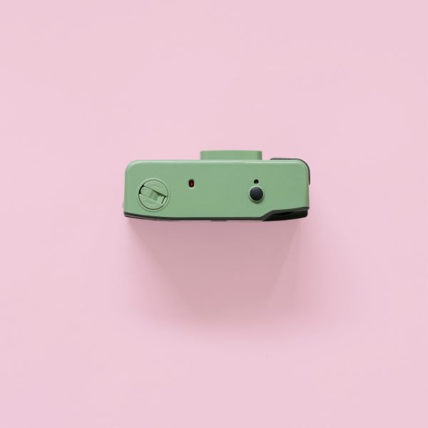 Long Weekend 35mm Film Camera Moss top on a pink background