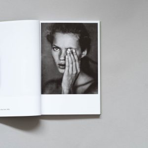 PAOLO ROVERSI Photofile book open to a page with a photo of Kate Moss